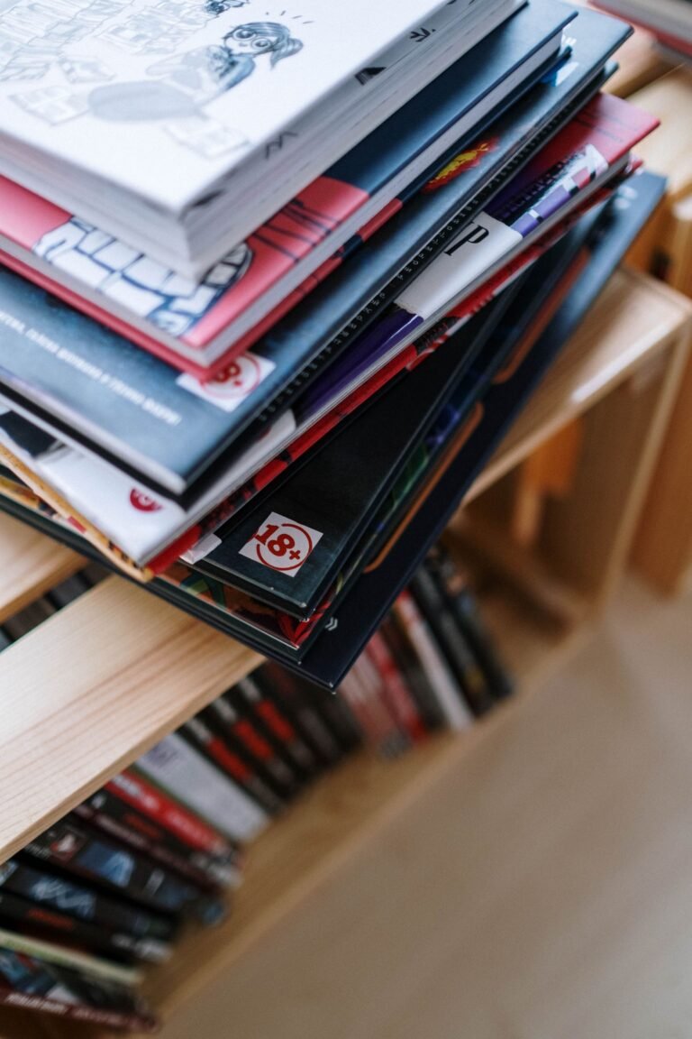 Stack of colorful comic books on a bookshelf