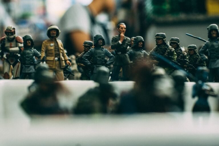 Miniature toy soldiers arranged in a battle formation on a table